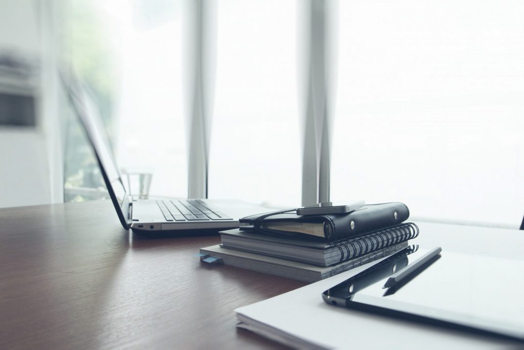 desk with computer and organizer